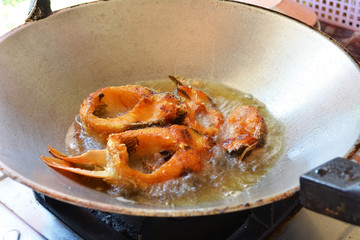 fried fish in the iron pan