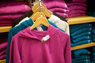woman's sweats hanging in trendy boutique