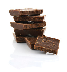 Closeup detail of chocolate parts on white background.