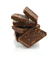 Closeup detail of chocolate parts on white background.