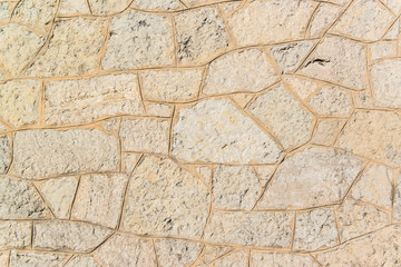 Old grey pavement of cobble stones in a circle pattern