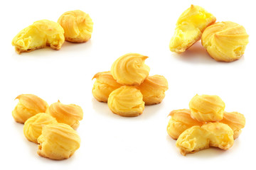 Cream puffs on white background