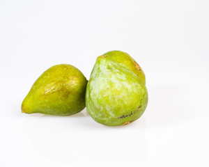 Fresh green figs picked ripe on white