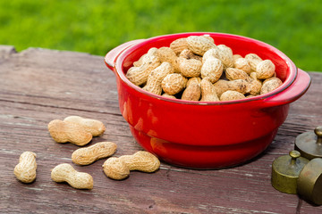 Peanuts on wooden table in the backyard