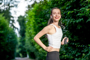 Running woman. Female runner jogging during outdoor workout in a