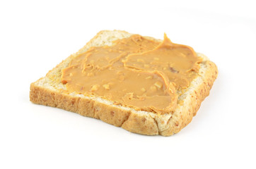 An open faced peanut butter sandwich on white bread