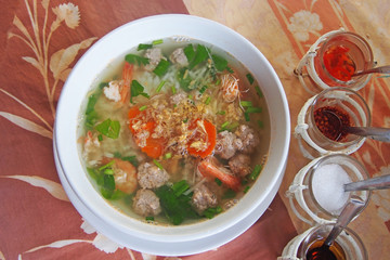 boiled rice with shrimp and minced pork in white bowl, top view