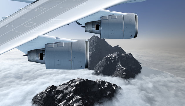 Tragfläche mit zwei Strahltriebwerken im Flug über ein Gebirge