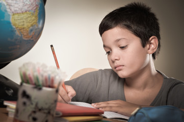 Child writing at school
