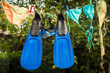 snorkeling equipment drying on clothesline