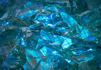 Turquoise background of shiny-crystal stones lit mysterious glow
