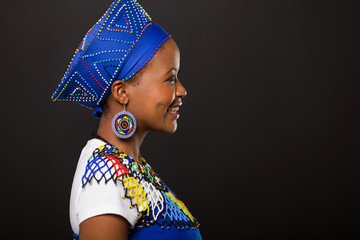 young african zulu woman on black background