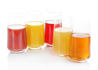 Variety of juices in glasses, isolated on white