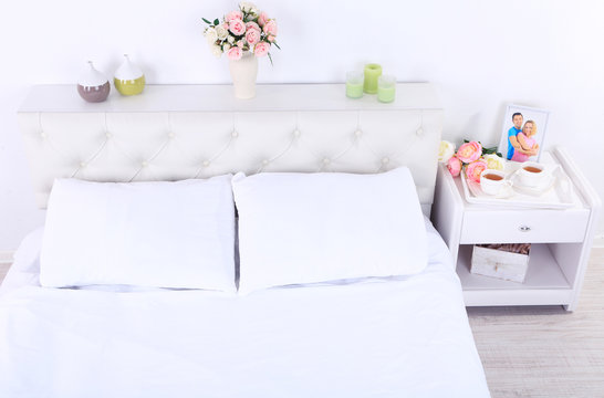 Comfortable soft bed in room © Africa Studio