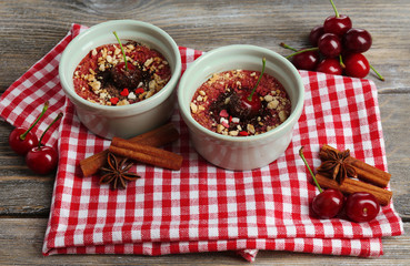 Tasty cherry dessert on table