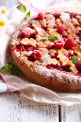 Tasty cake with berries on table close-up