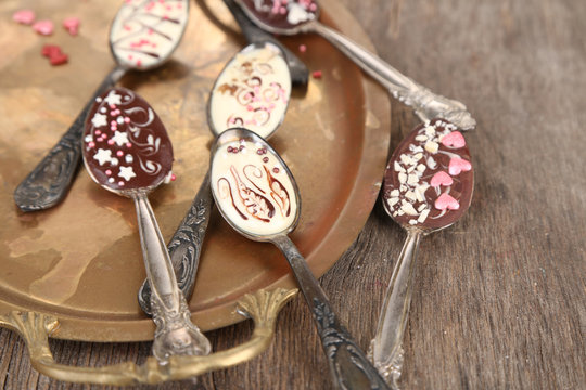 Spoons with tasty chocolate for party