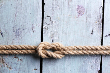 Fototapeta na wymiar Marine knot on wooden background
