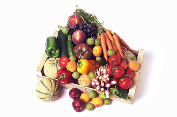 crates of fruit and vegetables on white background in studio.