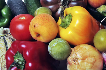 crates of fruit and vegetables on white background in studio.
