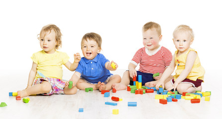 Children playing toy blocks. Baby Kids isolated white background