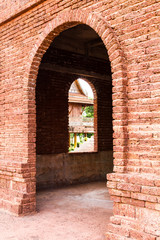 Entrance door and window openings of the old red brick wall