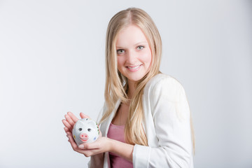 Fototapeta na wymiar Mädchen mit Sparschwein