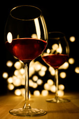 2 Red wine glasses. Christmas romantic dinner image.