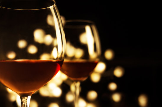 2 Red wine glasses. Christmas romantic dinner image.
