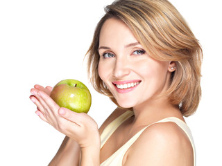 Young happy smiling woman with green apple.
