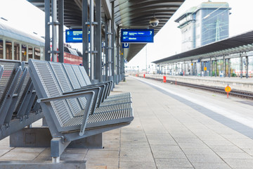 The steel chairs on the platform in train station