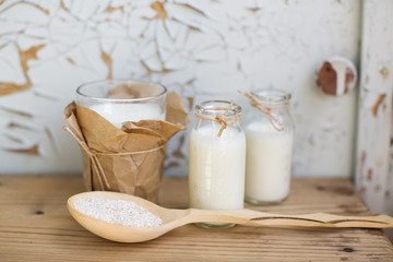 two glasses of milk and a spoon of bran