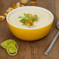 Leek and Potato soup with croutons. Selective focus.