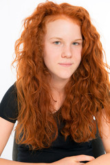 Obraz premium girl with red hair is looking friendly in to the camera