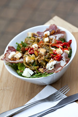 Mixed salad on a wooden table