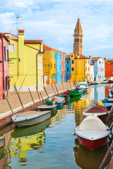 Fototapeta na wymiar Color houses with boats on Burano island near Venice