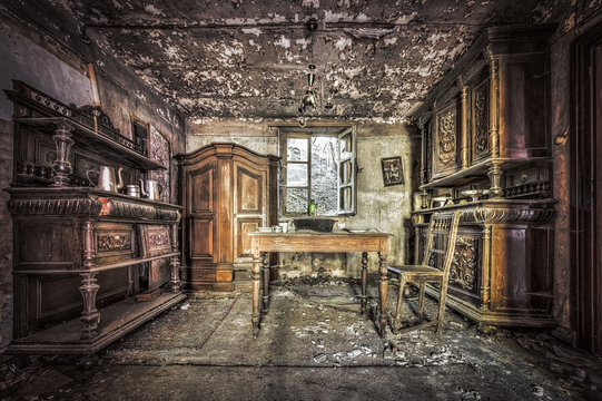 Decayed dining room in an abandoned house