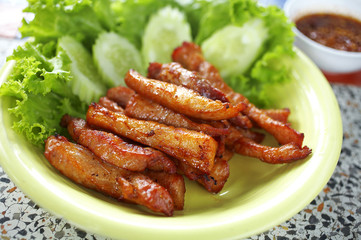 close up thai pork fried in white dish