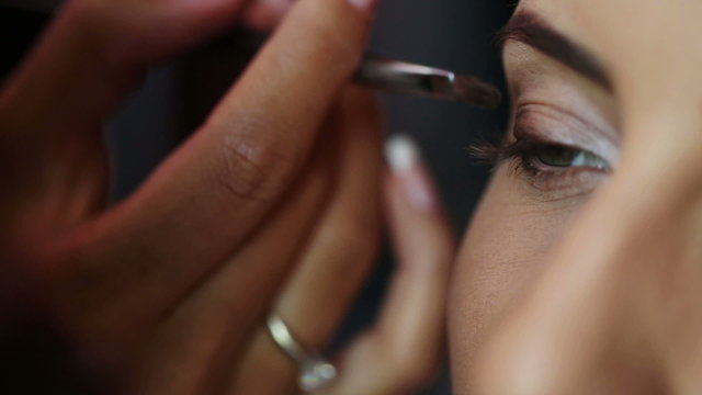 Makeup Artist Applying Eye Shadow
