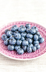 Fresh blueberries on the decorated plate