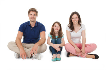 Happy Family Sitting Over White Background