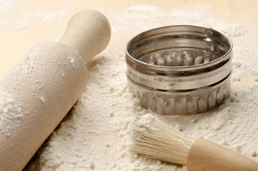 baking board with rolling pin, cookie cutter and brush