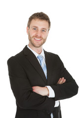 Businessman Standing Arms Crossed Over White Background