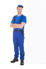 Worker Standing Arms Crossed While Leaning Over White Background