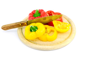 yellow sweet pepper slice and chopping block on white background