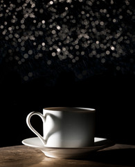 Coffee love. Warm cup of coffee on black background