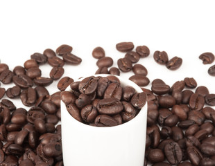 Closeup of coffee beans with focus on one