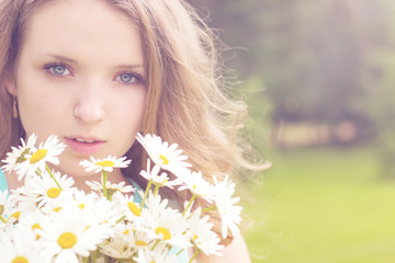 beautiful girl with a bouquet of daisies with white hair