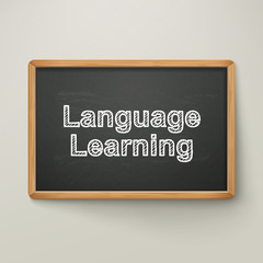 language learning on blackboard in wooden frame