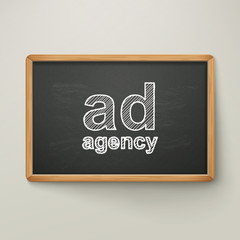 ad agency on blackboard in wooden frame